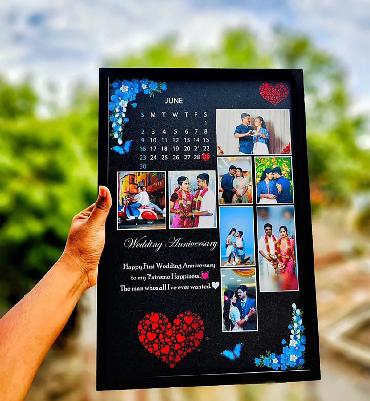 Personalized wedding anniversary photo calendar gift with blue flowers, red hearts, and couple photos for first anniversary